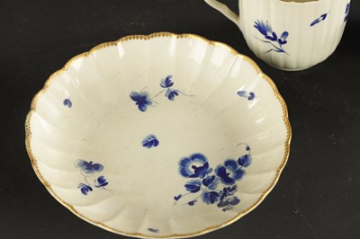 Lot 173 - A WORCESTER PORCELAIN FLUTED TRIO DECORATED WITH DRY BLUE FLOWERS CIRCA 1775