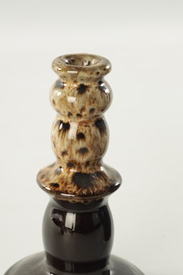 Lot 117 - A PAIR OF 19TH CENTURY SLIPWARE CANDLESTICKS AND MATCHING JUG