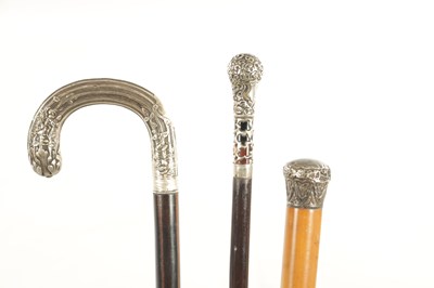 Lot 621 - A COLLECTION OF THREE EARLY 20TH CENTURY SILVER MOUNTED WALKING STICKS