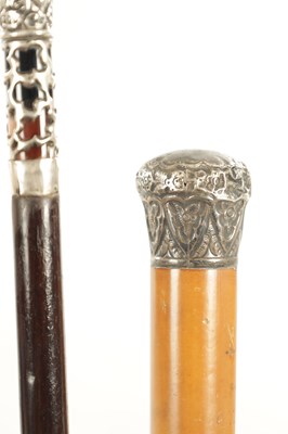 Lot 621 - A COLLECTION OF THREE EARLY 20TH CENTURY SILVER MOUNTED WALKING STICKS
