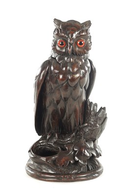Lot 1153 - A 19TH CENTURY BLACK FOREST CARVED WALNUT TOBACCO JAR FORMED AS AN OWL