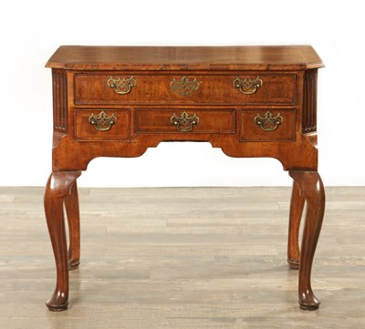 Lot 1199 - A GEORGE I FIGURED WALNUT LOWBOY
