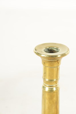 Lot 645 - A PAIR OF GEORGE III BRASS CANDLESTICKS
