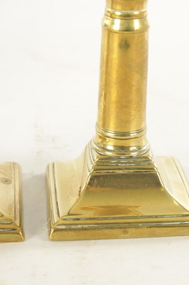Lot 645 - A PAIR OF GEORGE III BRASS CANDLESTICKS