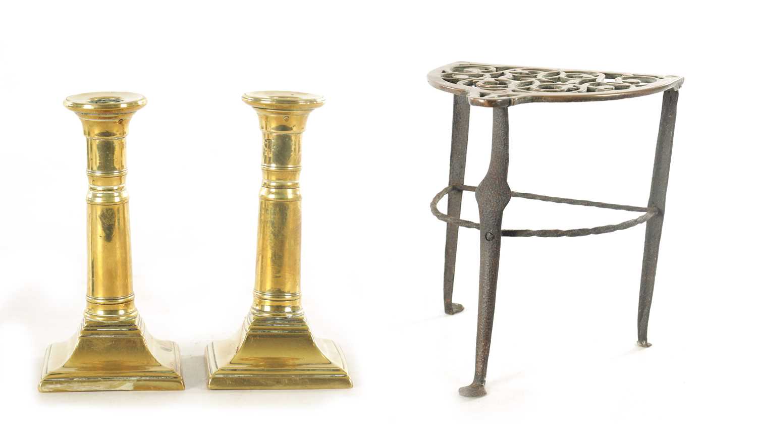 Lot 645 - A PAIR OF GEORGE III BRASS CANDLESTICKS