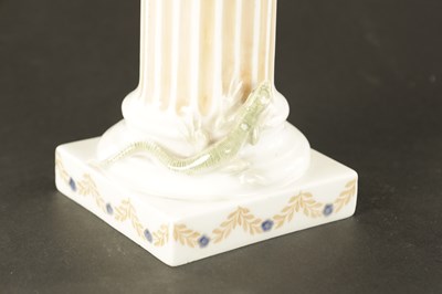 Lot 36 - AN EARLY 20TH CENTURY ROYAL COPENHAGEN FIGURE MODELLED AS FAUN ON COLUMNS WITH LIZARD
