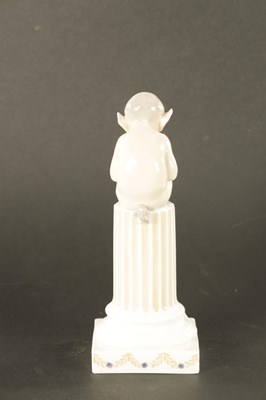 Lot 36 - AN EARLY 20TH CENTURY ROYAL COPENHAGEN FIGURE MODELLED AS FAUN ON COLUMNS WITH LIZARD
