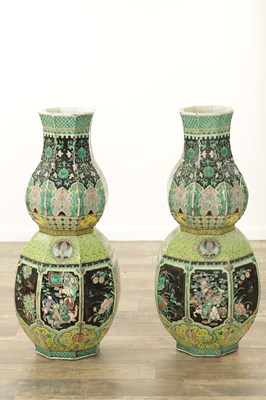 Lot 133 - AN IMPRESSIVE PAIR OF 19TH CENTURY CHINESE FAMILLE NOIRE DOUBLE GOURD HALL VASES