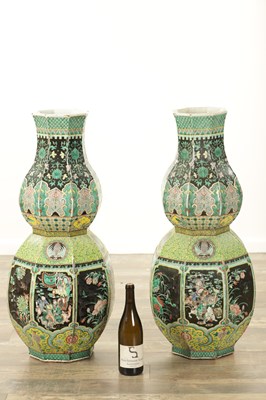 Lot 133 - AN IMPRESSIVE PAIR OF 19TH CENTURY CHINESE FAMILLE NOIRE DOUBLE GOURD HALL VASES