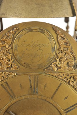 Lot 1067 - A LATE 17TH CENTURY BRASS WINGED LANTERN HOOK AND SPIKE WALL CLOCK