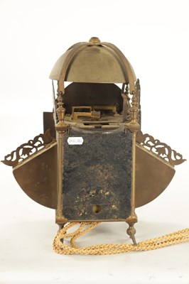 Lot 1067 - A LATE 17TH CENTURY BRASS WINGED LANTERN HOOK AND SPIKE WALL CLOCK