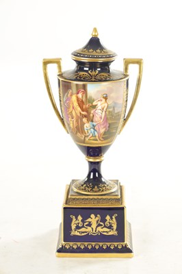 Lot 32 - A 19TH CENTURY VIENNA PORCELAIN TWO HANDLED LIDDED URN SHAPED VASE ON PEDESTAL