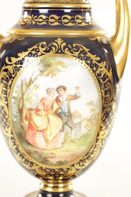 Lot 59 - A PAIR OF 19TH CENTURY VIENNA PORCELAIN RICHLY GILT AND ROYAL BLUE TWO HANDLED COVERED VASES