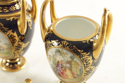 Lot 59 - A PAIR OF 19TH CENTURY VIENNA PORCELAIN RICHLY GILT AND ROYAL BLUE TWO HANDLED COVERED VASES