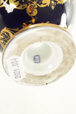 Lot 59 - A PAIR OF 19TH CENTURY VIENNA PORCELAIN RICHLY GILT AND ROYAL BLUE TWO HANDLED COVERED VASES