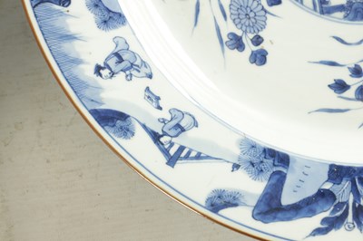 Lot 95 - A PAIR OF LARGE CHINESE QING DYNASTY BLUE AND WHITE PORCELAIN CHARGERS