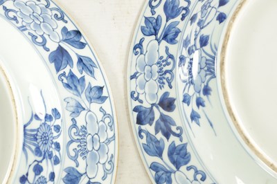 Lot 95 - A PAIR OF LARGE CHINESE QING DYNASTY BLUE AND WHITE PORCELAIN CHARGERS