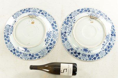 Lot 95 - A PAIR OF LARGE CHINESE QING DYNASTY BLUE AND WHITE PORCELAIN CHARGERS