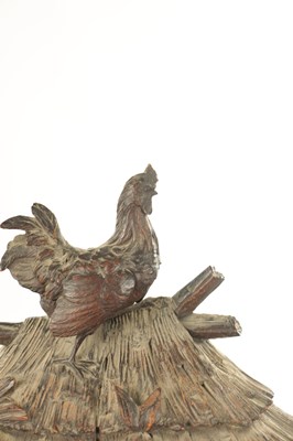 Lot 1079 - A LATE 19TH BLACK FOREST CARVED LINDEN WOOD MANTEL CLOCK