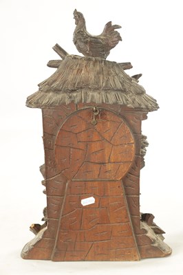 Lot 1079 - A LATE 19TH BLACK FOREST CARVED LINDEN WOOD MANTEL CLOCK