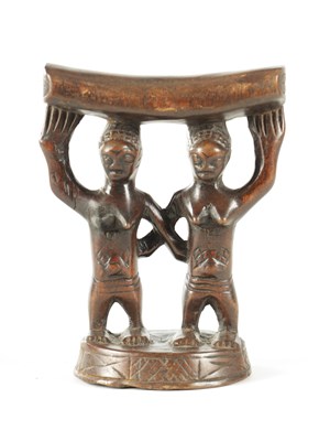 Lot 919 - AN AFRICAN HARDWOOD NECK REST