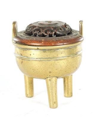 Lot 230 - AN 18TH/19TH CENTURY CHINESE BRONZE CENSER AND HARDWOOD COVER