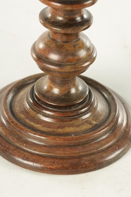 Lot 913 - A PAIR OF 19TH CENTURY TURNED WALNUT TREENWARE CANDLESTICKS