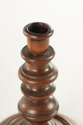Lot 913 - A PAIR OF 19TH CENTURY TURNED WALNUT TREENWARE CANDLESTICKS