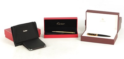 Lot 777 - A CARTIER PEN, CARTIER WALLET TOGETHER WITH AN AIGNER PEN