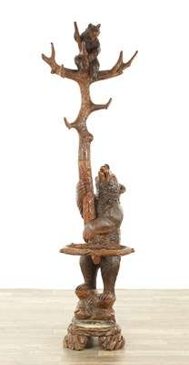 Lot 951 - A 19TH CENTURY CARVED LINDEN WOOD BLACK FOREST BEAR AND CUB HALL STAND