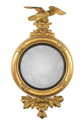 Lot 1380 - A REGENCY CARVED GILT GESSO CONVEX MIRROR