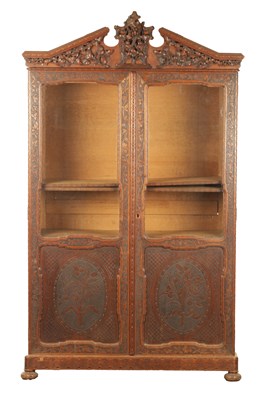 Lot 1232 - A 19TH CENTURY CARVED WALNUT BLACK FOREST DISPLAY CABINET OF SMALL SIZE