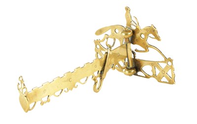 Lot 603 - A 19TH CENTURY BRASS HEARTH ARM