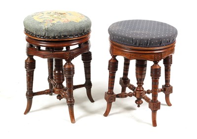 Lot 1217 - TWO 19TH CENTURY CIRCULAR WALNUT REVOLVING PIANO STOOLS