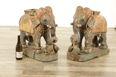 Lot 222 - A LARGE PAIR OF 19TH CENTURY INDIAN CARVED POLYCHROME PAINTED SCULPTURES OF ELEPHANTS