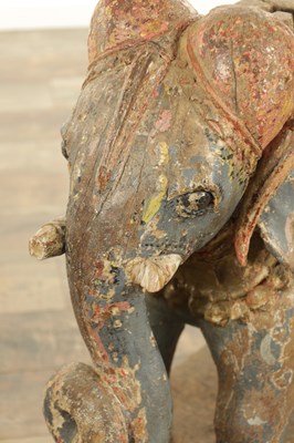 Lot 222 - A LARGE PAIR OF 19TH CENTURY INDIAN CARVED POLYCHROME PAINTED SCULPTURES OF ELEPHANTS