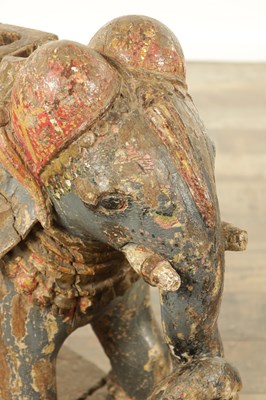 Lot 222 - A LARGE PAIR OF 19TH CENTURY INDIAN CARVED POLYCHROME PAINTED SCULPTURES OF ELEPHANTS