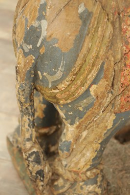 Lot 222 - A LARGE PAIR OF 19TH CENTURY INDIAN CARVED POLYCHROME PAINTED SCULPTURES OF ELEPHANTS