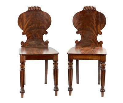 Lot 1391 - A PAIR OF REGENCY FLAMED MAHOGANY HALL CHAIRS IN THE MANNER OF GILLOWS