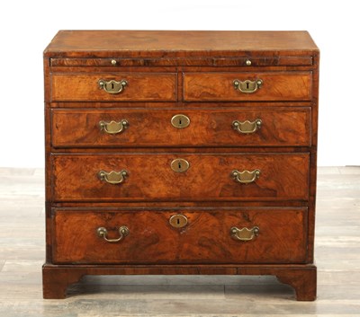 Lot 1399 - A GEORGE I FIGURED WALNUT BACHELORS CHEST