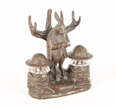 Lot 900 - A GOOD 19TH CENTURY BLACK FOREST CARVED LINDEN WOOD INKSTAND