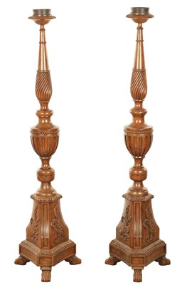 Lot 1304 - A PAIR OF 20TH CENTURY WALNUT TORCHERES