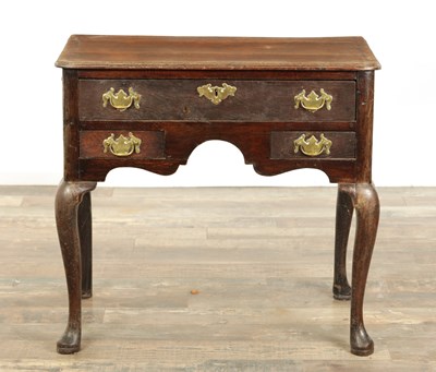 Lot 1316 - A GEORGE III OAK LOWBOY