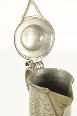 Lot 963 - AN ARTS AND CRAFTS PEWTER EWER