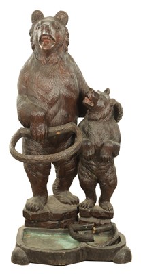 Lot 910 - A LATE 19TH CENTURY CARVED BLACK FOREST BEAR AND CUB STICK STAND