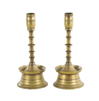 Lot 625 - A PAIR OF 20TH CENTURY EARLY DUTCH STYLE BRASS CANDLESTICKS
