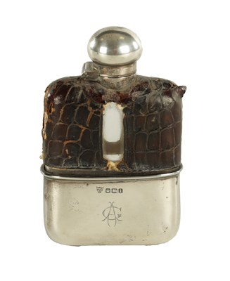 Lot 458 - A SMALL EARLY 20TH CENTURY SILVER MOUNTED CROCODILE SKIN HIP FLASK