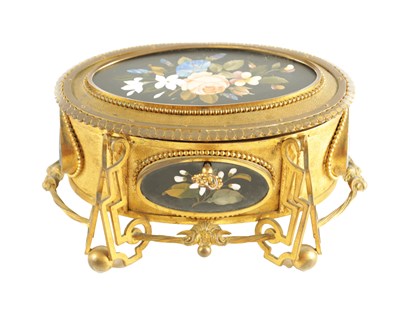 Lot 763 - A 19TH CENTURY FRENCH BRASS AND PIETRA DURA INLAID OVAL JEWELLERY CASKET