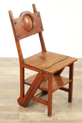 Lot 1347 - AN ARTS AND CRAFTS WALNUT METAMORPHIC LIBRARY CHAIR / STEPS