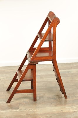 Lot 1347 - AN ARTS AND CRAFTS WALNUT METAMORPHIC LIBRARY CHAIR / STEPS